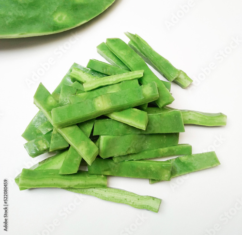 Chopped green leaf Nopal cactus, peeled and cut. on white background