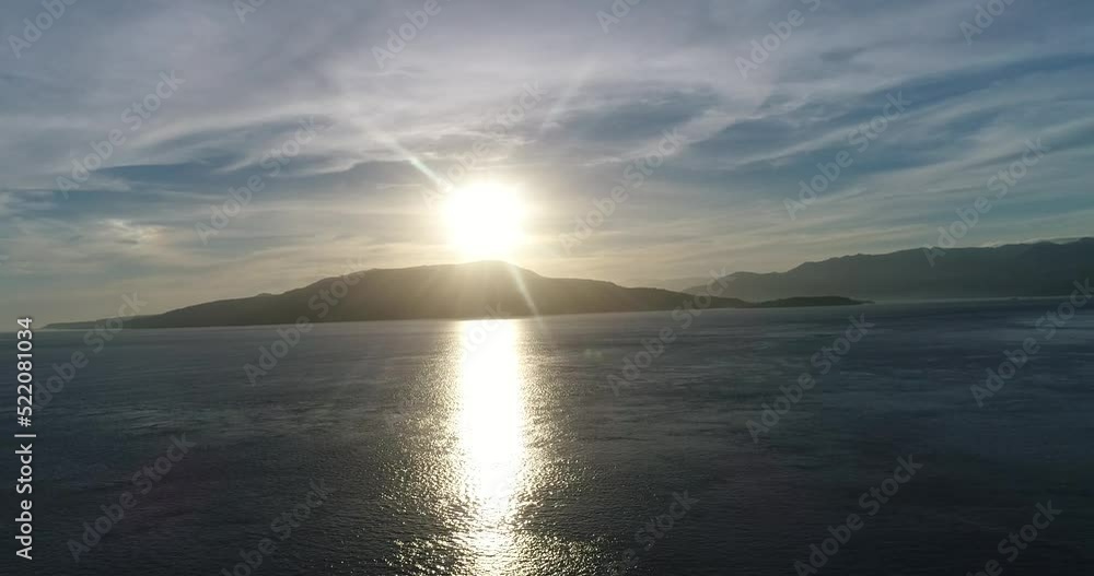 Aerial shot of a sunrise on a tropical volcanic island Aerial shot of a sunrise on a tropical volcanic island
