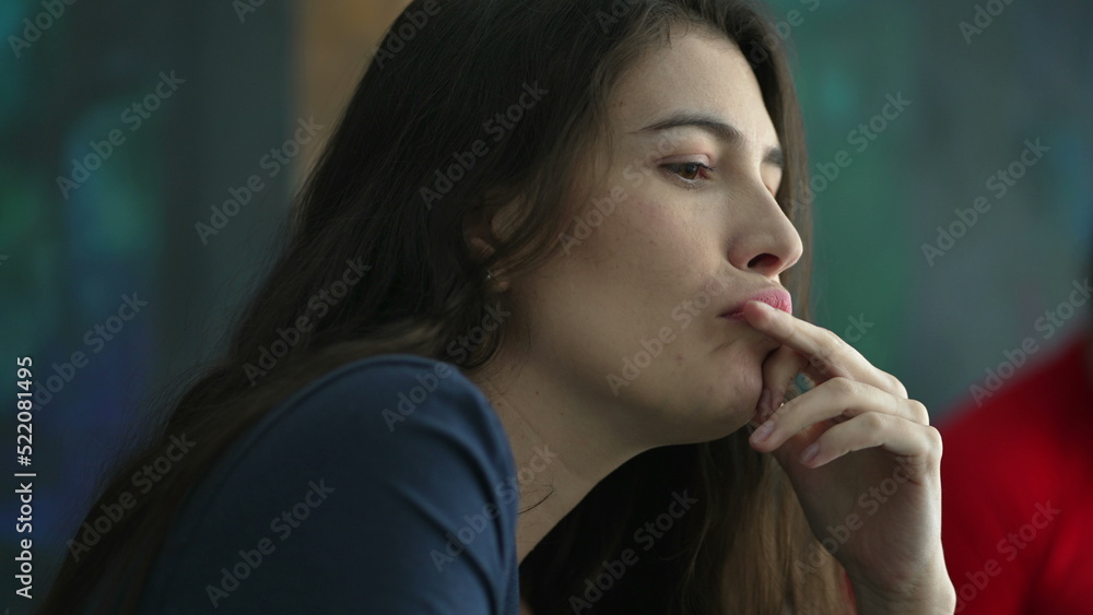 Fearful young woman face biting nail feeling anxiety. Pensive restless person pondering solution Fearful young woman face biting nail feeling anxiety. Pensive restless person pondering solution