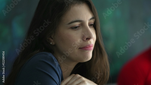Fearful young woman face biting nail feeling anxiety. Pensive restless person pondering solution