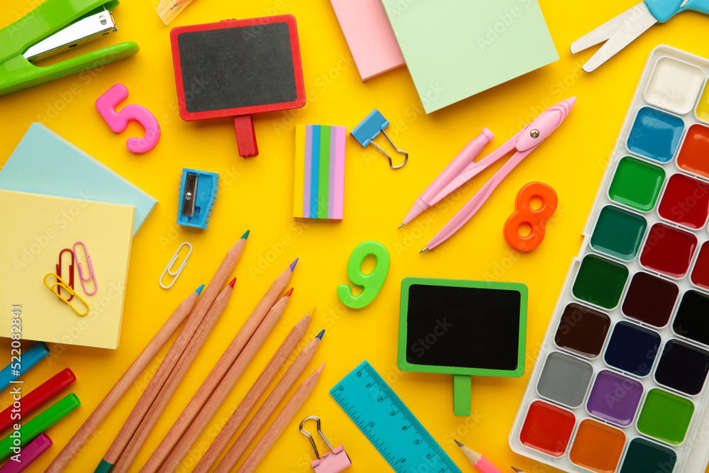 Different stationery on yellow background, flat lay with space for text. Back to school Different stationery on yellow background, flat lay with space for text. Back to school