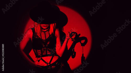 Εκτύπωση καμβά sexy slave girl in underwear and a hat holds handcuffs in hands