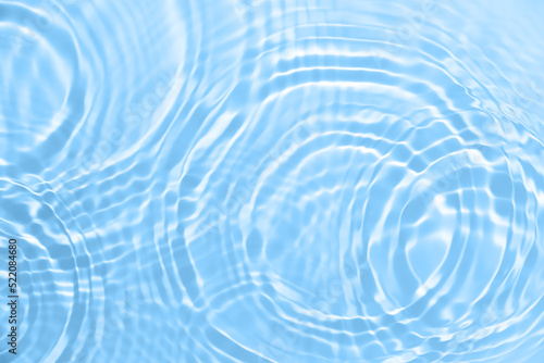 Fresh water background. Blue abstract pattern with clear rippled water texture. Top view