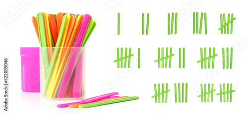 counting colorful sticks for the purposes of early education, development, learning to count and play. Banner with colored sticks on isolated white background