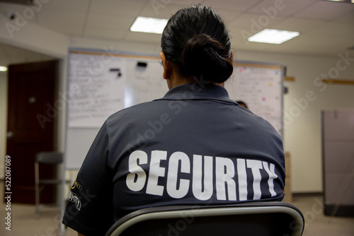 Security guard in uniform is training in meeting room