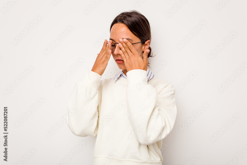 Young hispanic woman isolated on white background afraid covering eyes with hands. Young hispanic woman isolated on white background afraid covering eyes with hands.