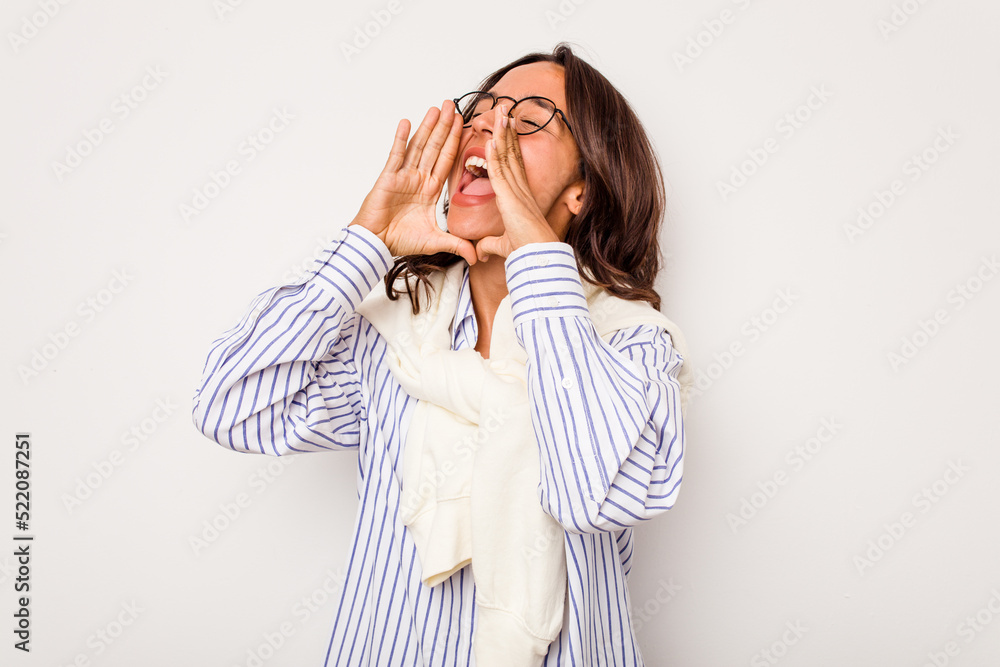 Young hispanic woman isolated on white background shouting excited to front. Young hispanic woman isolated on white background shouting excited to front.