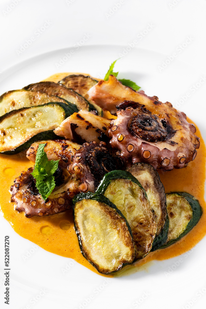 cooked octopus, served with courgettes and sauce cooked octopus, served with courgettes and sauce