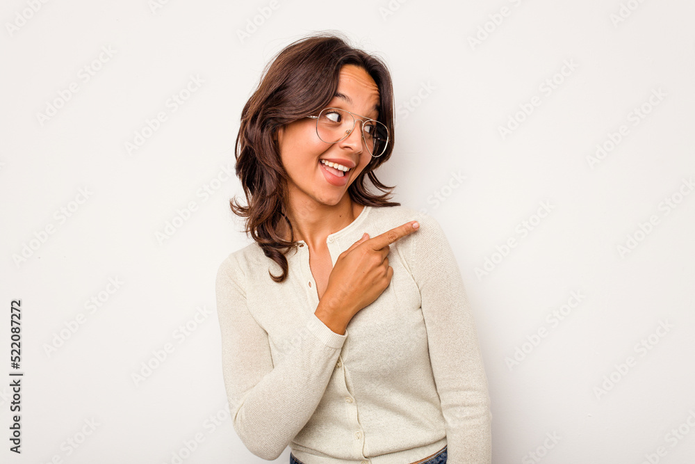 Young hispanic woman isolated on white background looks aside smiling, cheerful and pleasant. Young hispanic woman isolated on white background looks aside smiling, cheerful and pleasant.