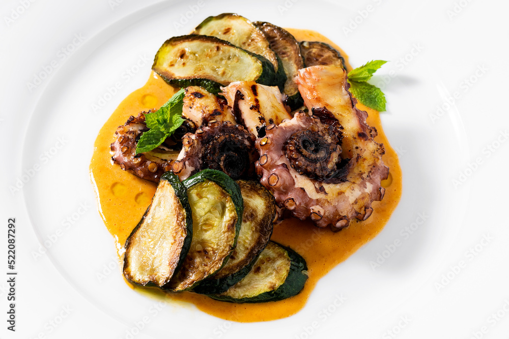cooked octopus, served with courgettes and sauce cooked octopus, served with courgettes and sauce