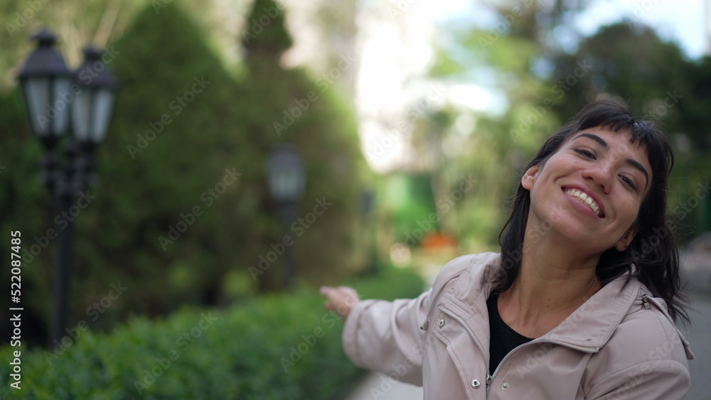 Carefree woman jumping with joy enjoying life. Female person celebrating success walking outside Carefree woman jumping with joy enjoying life. Female person celebrating success walking outside