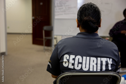 Security guard in uniform is training in meeting room