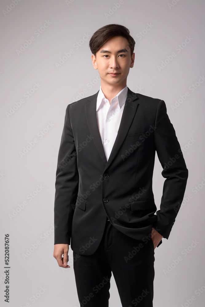Young businessman wearing suit over white background studio Young businessman wearing suit over white background studio