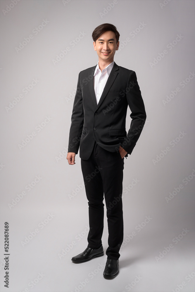 Young businessman wearing suit over white background studio Young businessman wearing suit over white background studio