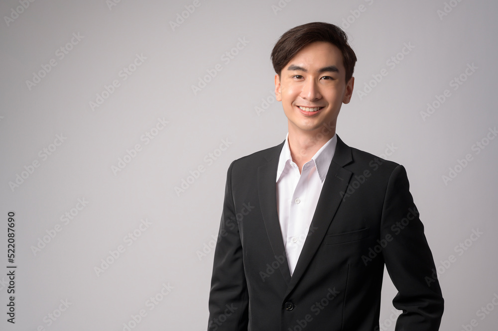 Young businessman wearing suit over white background studio Young businessman wearing suit over white background studio