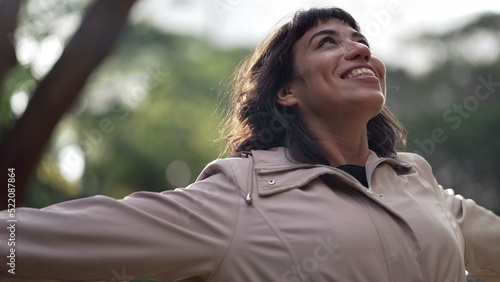 A joyful hispanic woman feeling happy. South American person celebrates achievement and success