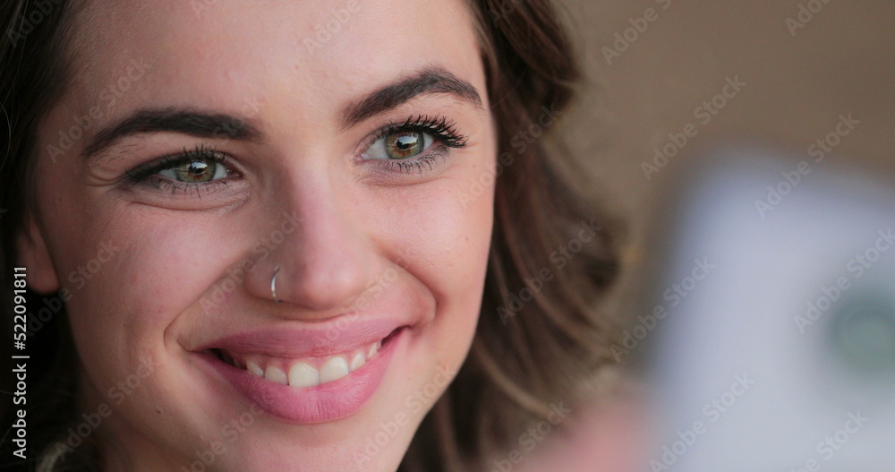 Young woman posing for selfie with cellphone, rack focus on smartphone and person taking photo Young woman posing for selfie with cellphone, rack focus on smartphone and person taking photo