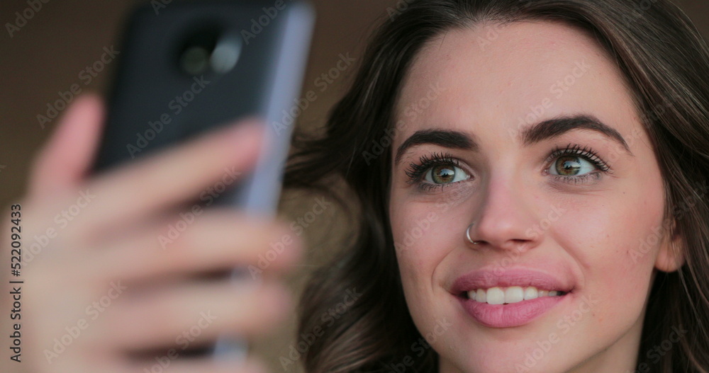 Young woman posing for selfie with cellphone Young woman posing for selfie with cellphone