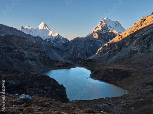 mount jampayang and chanadorje and lake boyongcuo at sunrise in yading, daocheng