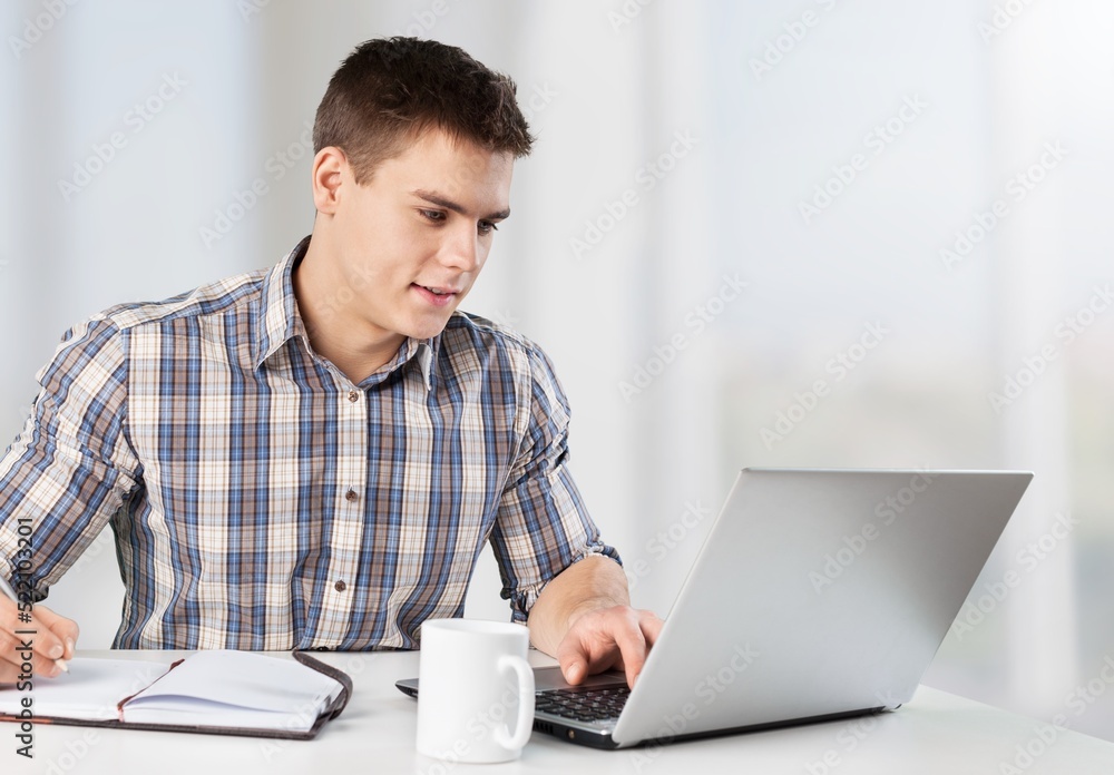 Thoughtful concentrated business man entrepreneur investor manager using computer, Thoughtful concentrated business man entrepreneur investor manager using computer,