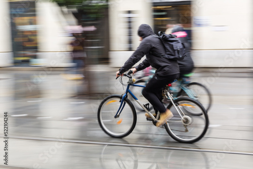cyclists at rain on the move in the city © Christian Müller