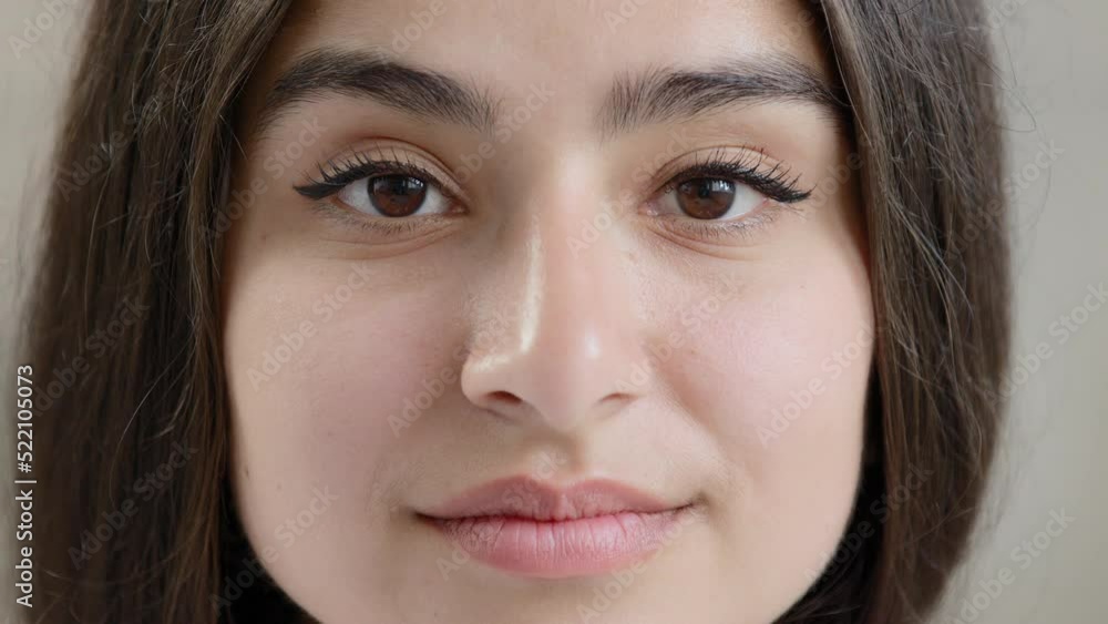 Close up female body part human young face sensual sexy arabic islamic attractive beautiful girl model lady gorgeous woman with black eyeliner on dark eyes natural daily makeup stare looking at camera Close up female body part human young face sensual sexy arabic islamic attractive beautiful girl model lady gorgeous woman with black eyeliner on dark eyes natural daily makeup stare looking at camera