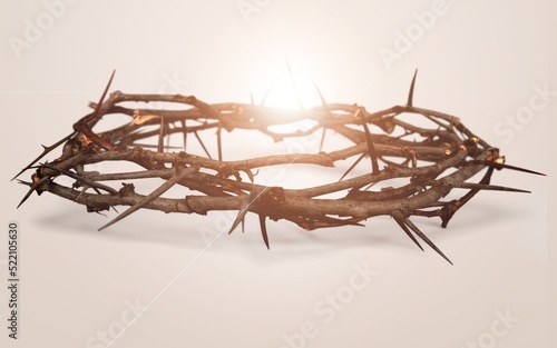 Crown of thorns symbolizing the sacrifice, suffering and resurrection of Jesus Christ and Easter light background