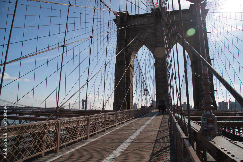 Fototapeta premium New York, NY, USA - February 2nd, 2017 - Strolling the fabulous Brooklyn Bridge
