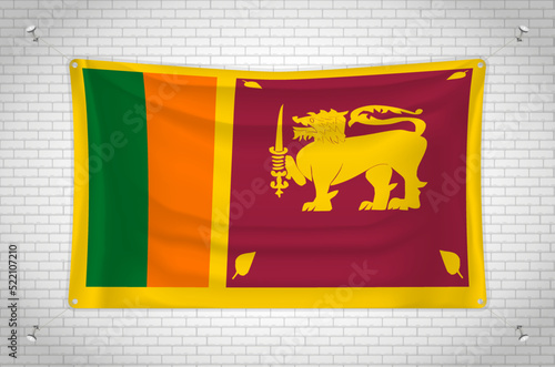 Sri Lanka flag hanging on brick wall. 3D drawing. Flag attached to the wall. Neatly drawing in groups on separate layers for easy editing.