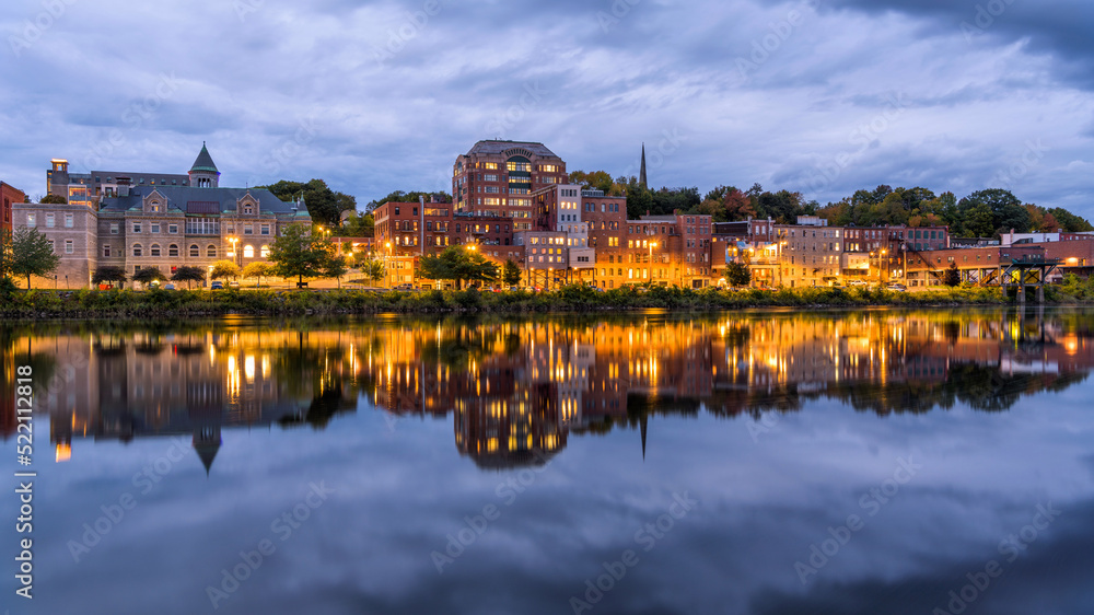Downtown Augusta at Riverfront - A wide-angle view of Downtown Augusta at shore of Kennebec River on a stormy Autumn evening. Maine, USA.