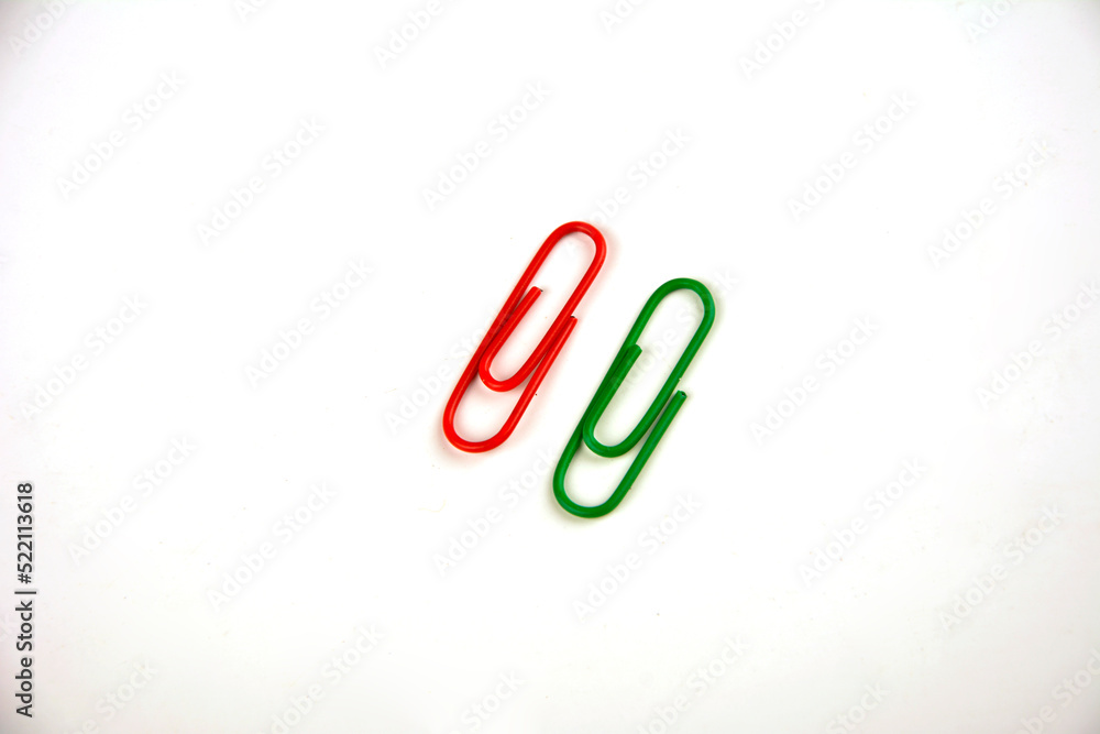 Colored paper clips on a white background. Colored paper clips on a white background.