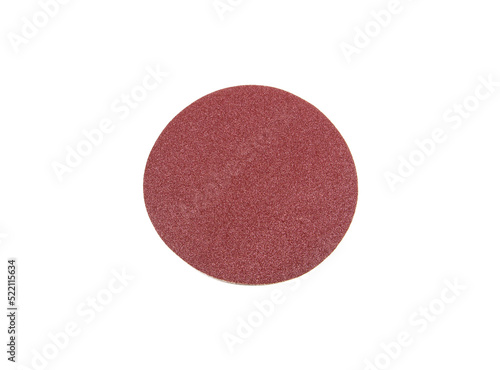 Round sandpaper of red color, used for removing impurities from various materials.