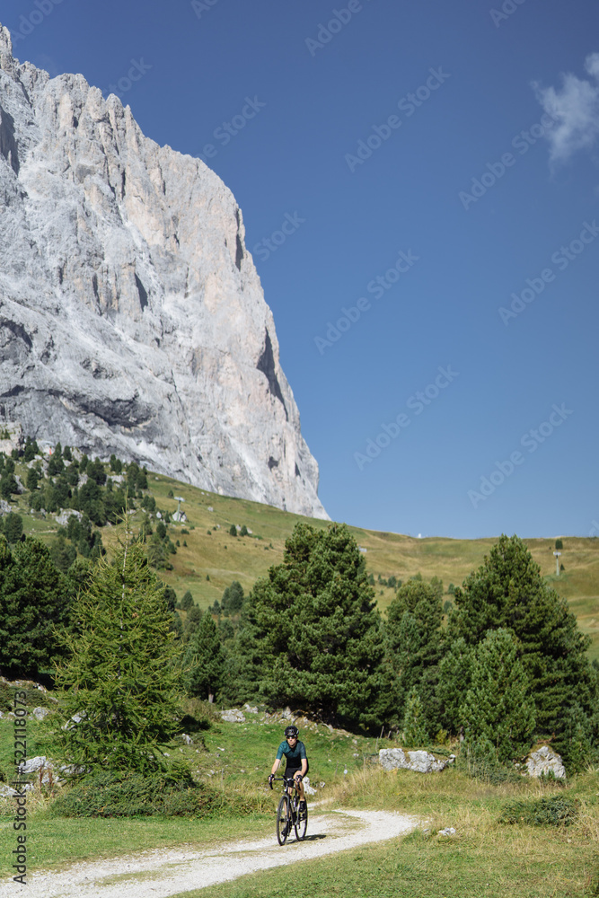 Fototapeta premium Road cyclist climbing the Italian Dolomites