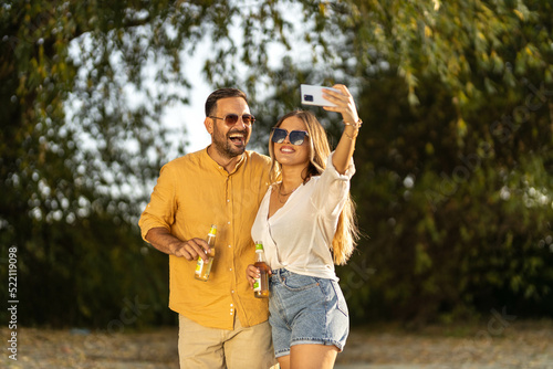 Couple having fun outdoors and taking selfies, summer time stock photo © Nemanja