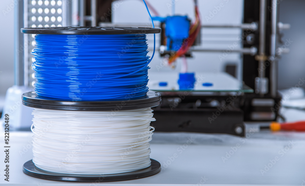 Personal 3d printer and abs or pla filament coils next to him. - obrazy, fototapety, plakaty 
