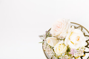 Composition work from pink roses on white background. Flat lay. Top view