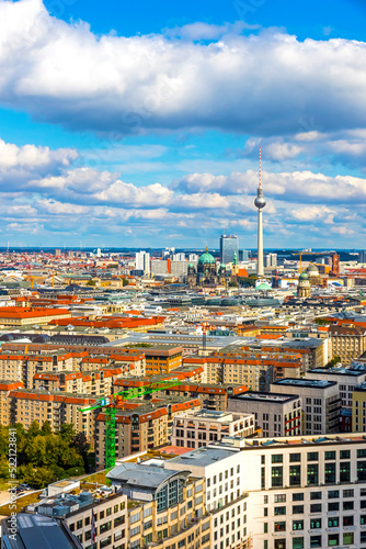 Skyline aerial view of Berlin city, Germany. TV tower (Fernsehturm) at Alexanderplatz and Berliner Dom on background. Panorama of central Berlin Mitte