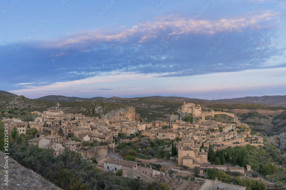 Pink sunset overlooking the medieval village of Alquezar which is located in the province of Huesca (Spain). Alquezar is one of the most beautiful medieval villages in Spain. 