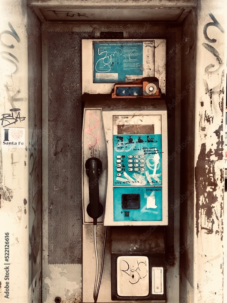 old abandoned building, telephone in the street old abandoned building, telephone in the street