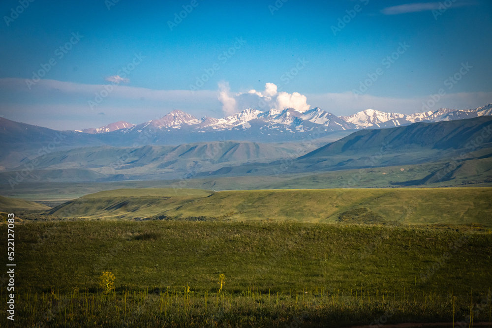 Obraz premium suussamyr valley in kyrgyzstan, mountain landscape, central asia, green valley, pasture