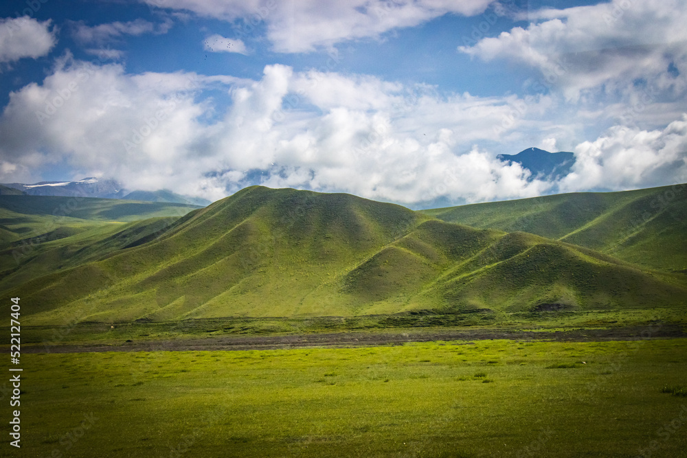 suussamyr valley in kyrgyzstan, mountain landscape, central asia, green valley, pasture