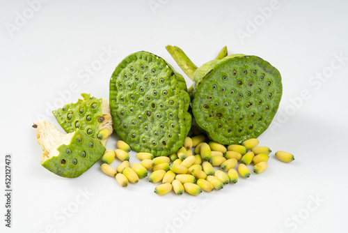 Fresh lotus seeds on a simple background