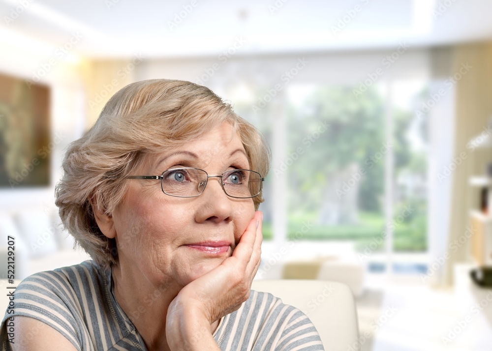 Thoughtful bored older woman looking at window, feeling depressed, frustrated, lonely, suffering form memory loss, dementia Thoughtful bored older woman looking at window, feeling depressed, frustrated, lonely, suffering form memory loss, dementia