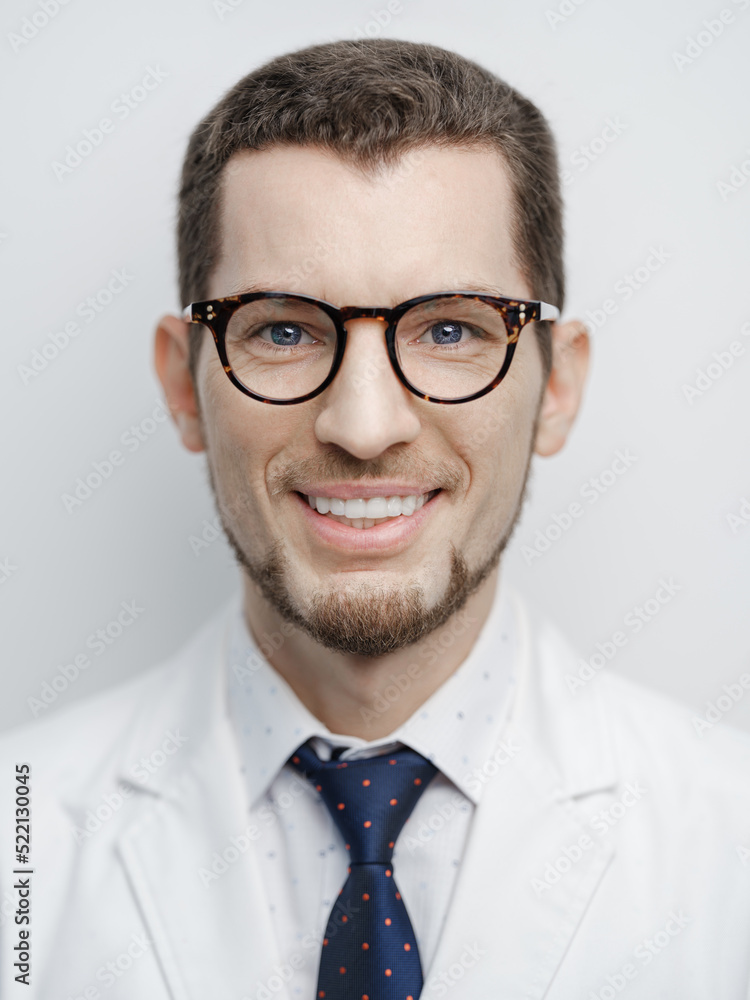 Portrait of happy young bearded male doctor smiling with eyeglasses isolated on white background Portrait of happy young bearded male doctor smiling with eyeglasses isolated on white background