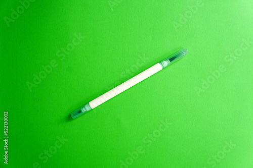 Emerald green marker on a green background, a fresh mood. Back to school. Double sided art marker