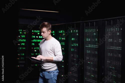 Worker assessing consequences of breakage of servers 