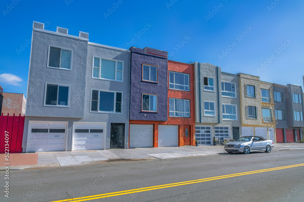 Photo & Art Print Townhouses with attached two-car garages beside