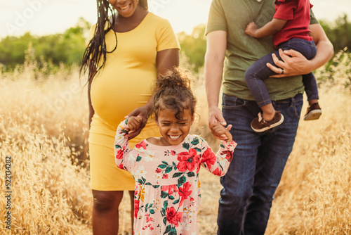 Girl Holding Hands with Family