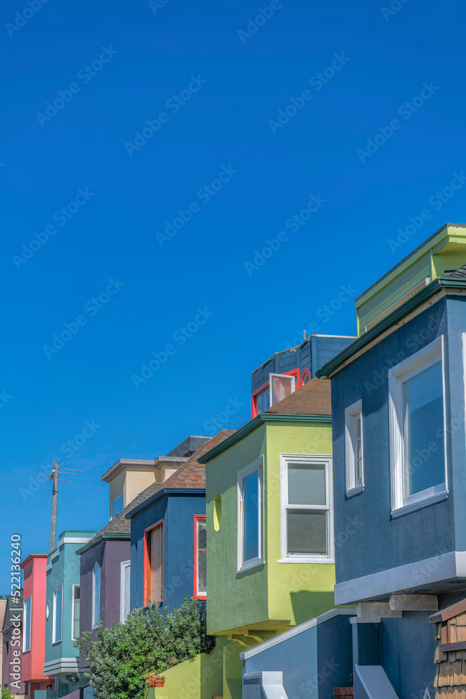Colorful row of houses against the blue sky at San Francisco, California Colorful row of houses against the blue sky at San Francisco, California
