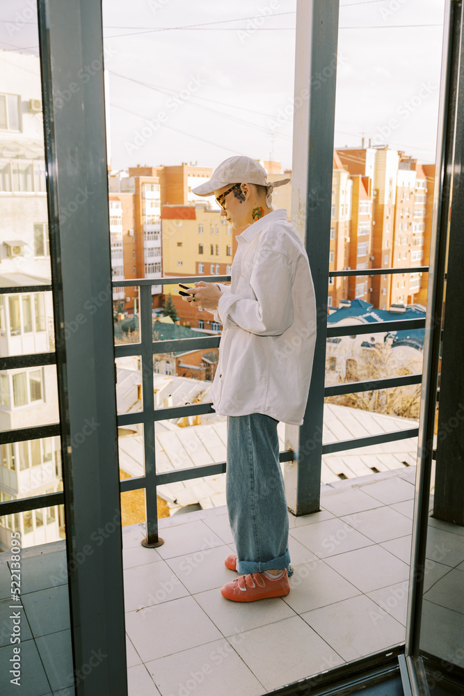 Androgyne person on the balcony Androgyne person on the balcony